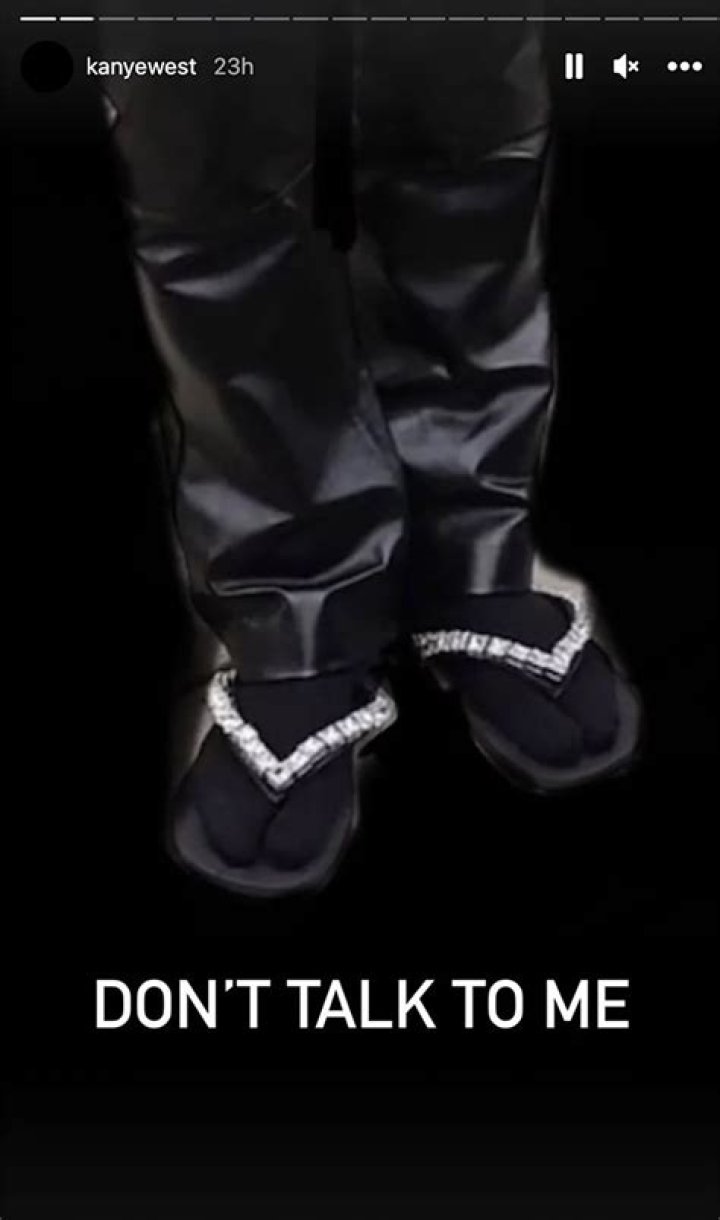 
Kanye West Steps Out at Burberry Show in Bedazzled Flip Flops and Socks: ‘Don’t Talk to Me’ 